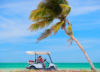 Wall Mural - Golf cart at tropical beach