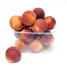 Poster - fresh and juicy peaches in a plastic box