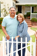 © Monkey Business - Senior Hispanic couple outside home
