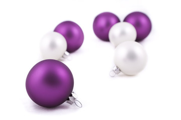 Purple and white christmas decorations on white background