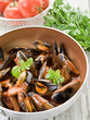 mussel  with tomato sauce and basil over casserole