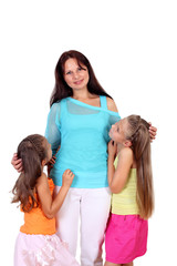 Mother with her two daughters in studio