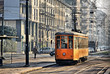 Old vintage orange tram on the street of Milan, Italy