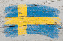 Flag Of Sweden On Grunge Wooden Texture Painted With Chalk
