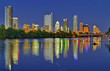 Austin skyline from the shores of Lady Bird Lake at twilight