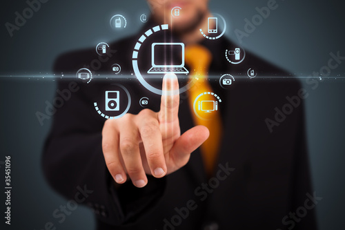 Fotografie, Obraz Businessman pressing virtual media type of buttons
