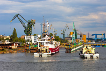 Docking of the vessel, assisted by tugs.