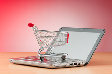 Internet online shopping concept with computer and cart