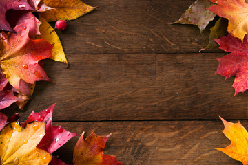 yellow  autumn leaves on background old wood