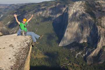 Rock climber celebrates on the summit.
