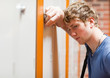 © WavebreakmediaMicro - Close up of a lonely student leaning on a locker