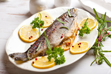 Oven Baked Trout With Lemons And Rosemary