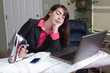 Exhausted Hispanic Woman Telecommuting