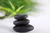 Fototapeta Desenie - SPA Wellness Steine schwarz mit Bambuspflanze Nahaufnahme