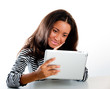 © Ant Clausen - Mixed race teen girl, looking at tablet computer