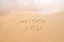 Miss You Text Written On The Beach Sand