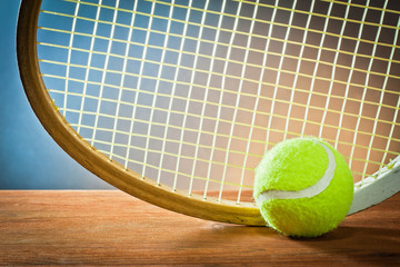 Sports equipment.tennis and racket on wood.