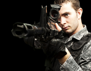 Wall Mural - young soldier aiming