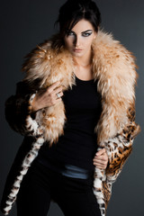beautiful fashionable woman in fur coat