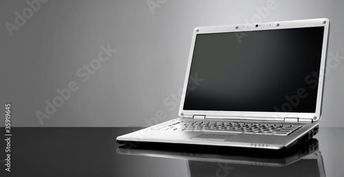Fotografía Modern laptop isolated on black background