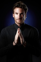 Poster - Priest praying with rosary