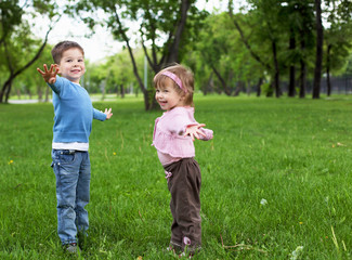 Wall Mural - happy sister and brother outdoors