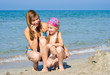 © olegator1977 - Mother and daughter on the beach