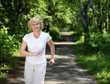 Fototapeta Przestrzenne - Elderly woman likes to run in the park
