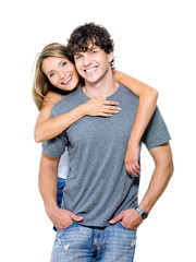 Portrait of young smiling couple on white background