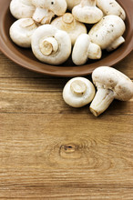 Fresh Mushrooms On A Wooden Board