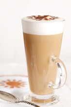 Coffee Latte With Frothy Milk In Tall Glass