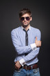 © mast3r - Fashion handsome man posing over black background
