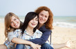 © Masson - Three girls at outdoor near beach.