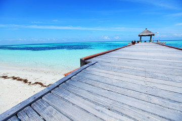 Wall Mural - resort maldivian houses in blue sea