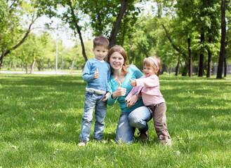 Wall Mural - Portrait of mother and children in the park