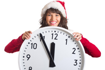 Weihnachtsfrau hält große Uhr in den Händen