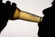 © Monkey Business - Silhouette man drinking beer
