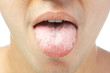 closeup of young men shows tongue isolated on white background