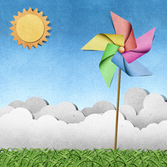 Wall Mural - windmill on grass recycled papercraft background