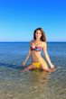 © Netfalls - Sexy bikini model having fun in the ocean