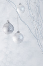 Christmas Silver Baubles With Sparkle Background Vertical