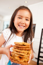 Happy Cute Girl Holding Cookies