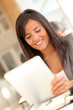 © goodluz - Beautiful businesswoman using electronic tablet