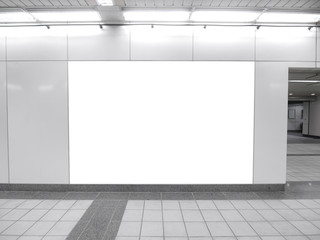 Blank billboard in underground passage