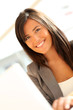 © goodluz - Portrait of beautiful businesswoman at work