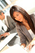 © goodluz - Portrait of beautiful businesswoman at work
