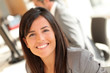 © goodluz - Portrait of beautiful businesswoman at work