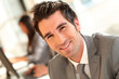 © goodluz - Portrait of smiling businessman