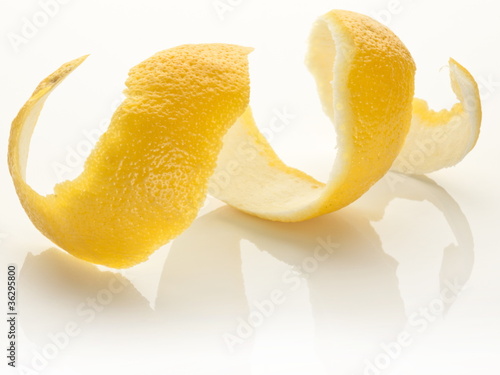 Cuadros en Lienzo Twist of citrus peel on a white background.