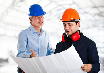 Engineer and a worker in a construction site